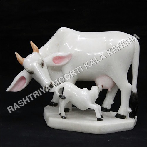 Polishing Kamdhenu Cow Statue