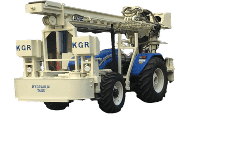 White & Blue Tractor Mounted Drilling Rig