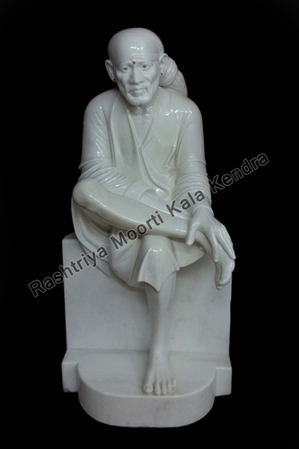 Polishing Sai Baba Statue