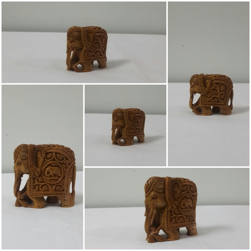 sandal wood carving elephent