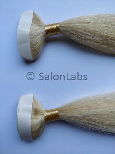 Tape in human hair extensions