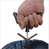 Tubeless tire puncture repair tool