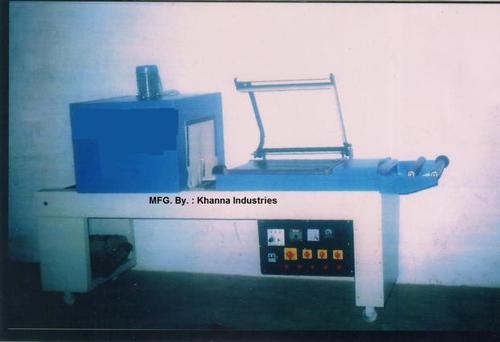 CONVEYOR TYPE SHRINK WRAPPING MACHINE WITH L-SEALER