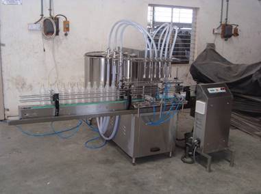 Four Head Volumetric Liquid Bottle Filling Machine