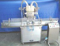 Four Head Volumetric Liquid Bottle Filling Machine