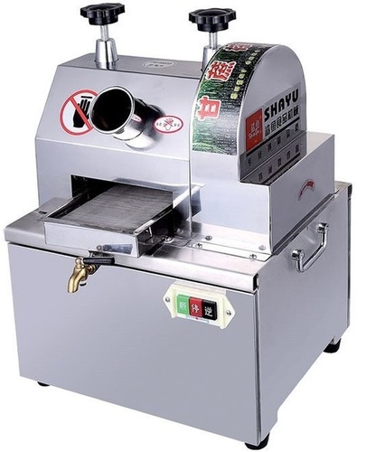 Sugar cane juice extractor