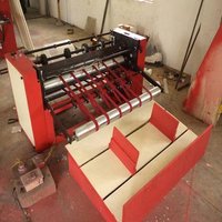 Red And Black And White Rotary Sheet Cutting Machine