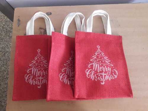 Christmas Jute Carry Bags - 9 x 7 x 5 Inches | Eco-Friendly Material, Red and White Color, Customizable Design with Hand Length Handle