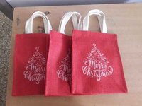 Christmas Jute Carry Bags - 9 X 7 X 5 Inches | Eco-friendly Material, Red And White Color, Customizable Design With Hand Length Handle