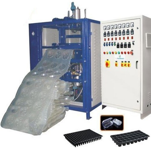 Blue And Cream Automatic Vacuum Forming Machine