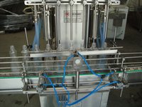 AUTOMATIC FOUR HEAD FILLING MACHINE