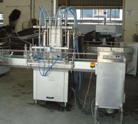 AUTOMATIC FOUR HEAD FILLING MACHINE