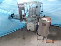 AUTOMATIC FOUR HEAD FILLING MACHINE