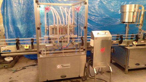 AUTOMATIC SIX HEAD LIQUID FILLING MACHINE