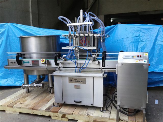 AUTOMATIC SIX HEAD LIQUID FILLING MACHINE