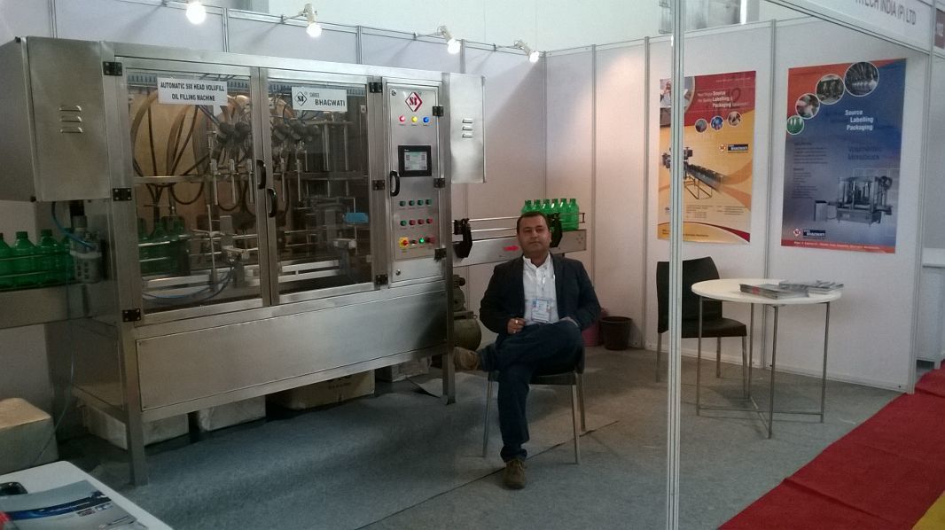 AUTOMATIC VOLUMETRIC TWO HE.AD FILLING MACHINE