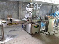 AUTOMATIC VOLUMETRIC TWO HEAD FILLING MACHINE