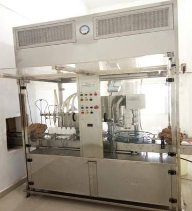 Monoblock Liquid Filler With Capper Along With Laminar Air Flow Cabinet