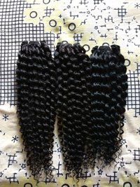 Curly human hair extension