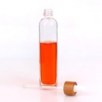 Wholesale 80ml glass cosmetic glass bottle with bamboo cap