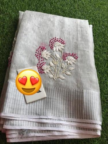 PURE TISSUE BY LINEN MACHINE CUT WORK EMBROIDERY SAREE .