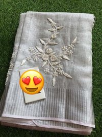 PURE TISSUE BY LINEN MACHINE CUT WORK EMBROIDERY SAREE .