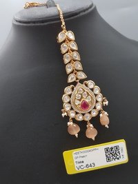 Kundan Tikka - Kundan And Gold Plated Material, Teardrop Shape, Gold Color | Ruby Stone Accent For Memorable Special Occasions