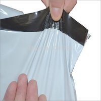 White and Black Plastic Courier Bag