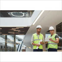 Construction Workers In Office Building