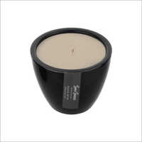 White Scented Candle In Black Ceramic Jar