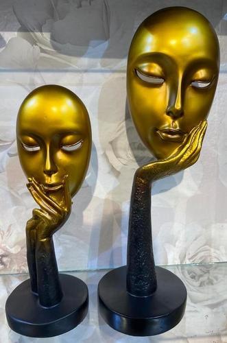 Resin two lady face statues