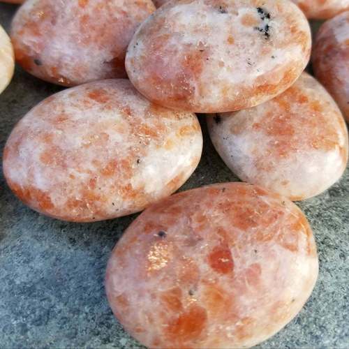 Oval Cut Sun Stone Crystal Palm Stone