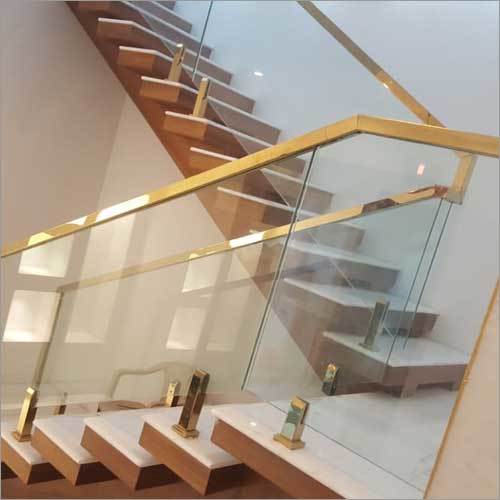 Glass Railing With Gold Handrails