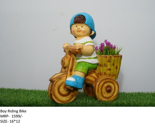 Boy Riding Bike Dimensions: Decorative Items Inch (In)