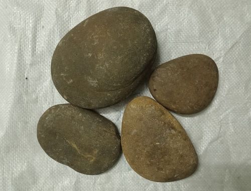 Brown Red Round Stepping Stone and flat big rock stone pebbles supplier in India