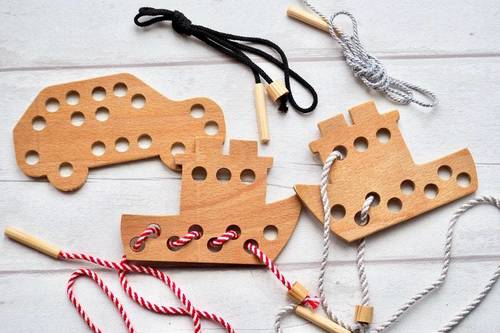 Wooden lacing game