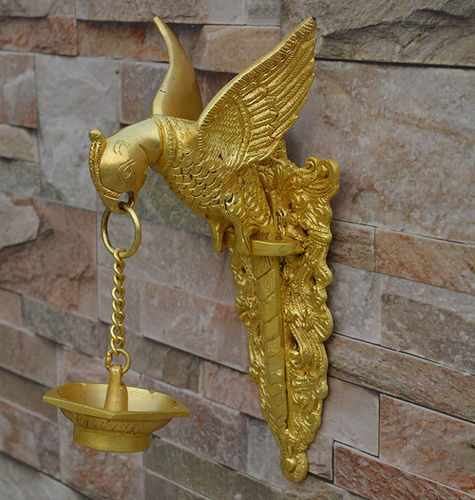 Brass made bird holding oil lamp wall diya wall decor