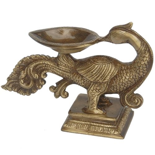 Decorative and  designer brass metal peacock shape candle stand oil lamp by Aakrati