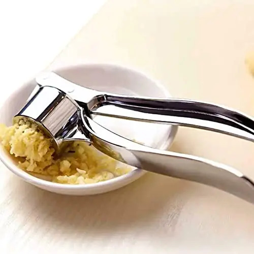 Silver Hand Held Garlic Crusher