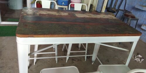 Metal table with reclaimed top