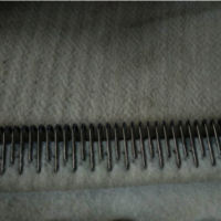 Needle corrugator belt