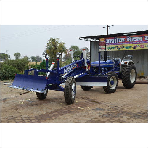 Blue Grader Attachment Over Tractor