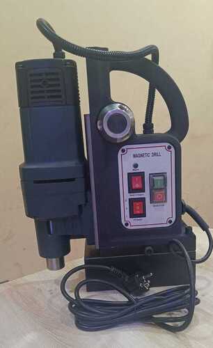 Portable drilling and tapping machine