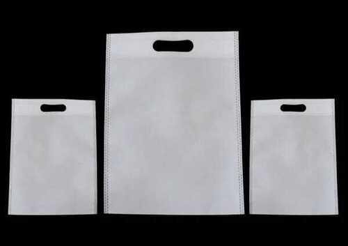 White D Cut Non Woven Fabric Bag - PP Material,  Lightweight, Plain White,  Smooth Texture,  Waterproof Design | Ideal for Shopping Use
