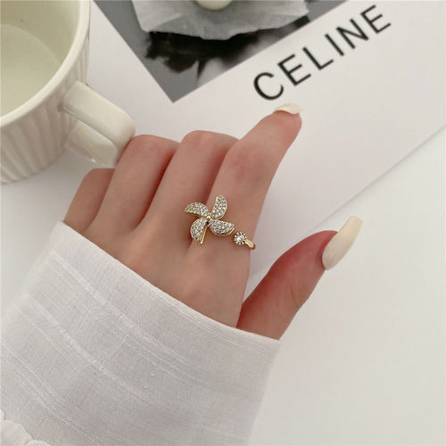 Rotating Cubic Zirconia Studded Adjustable Gold-Plated Spinner Ring Gender: Women