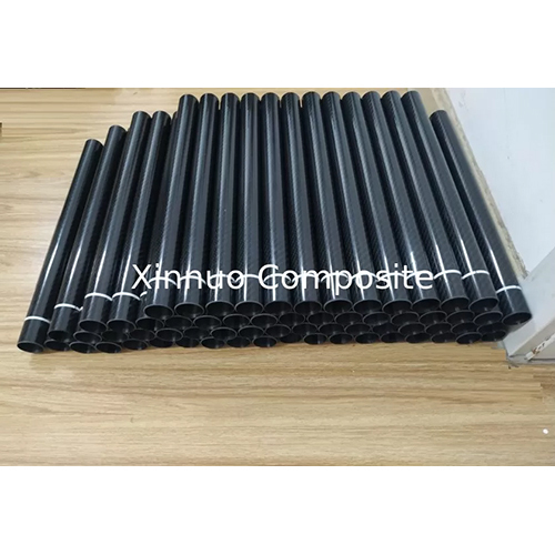 30mm Diameter Roll Wrapped Carbon fiber tubing with white warning tape provided by Chinese factory