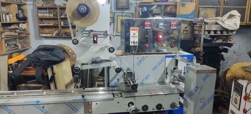 LADDU TYPE CHIKKI PACKAGING MACHINE