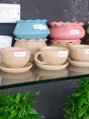 Syramic design in cup saucer shape pots