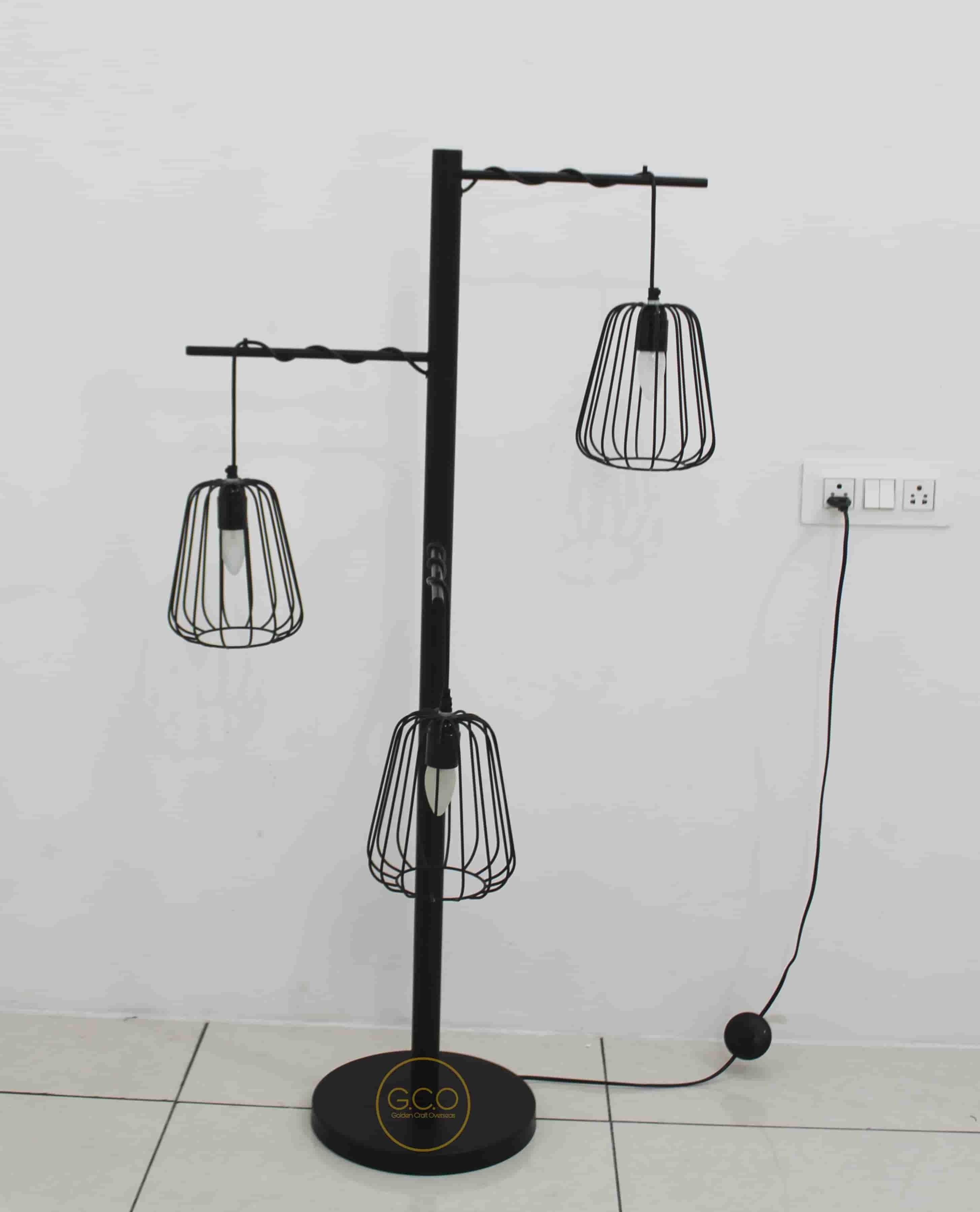 Three Arms Floor Lamp in iron with matte black powder coated finish for interior lighting