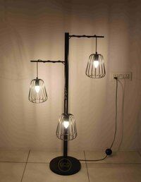 Three Arms Floor Lamp in iron with matte black powder coated finish for interior lighting